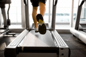 man running on treadmill - feet close up - podiatry Sunshine coast