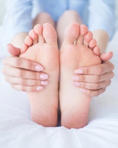 Woman Doing A Foot Massage — Sunshine Coast Orthotics & Podiatry in Kuluin, QLD